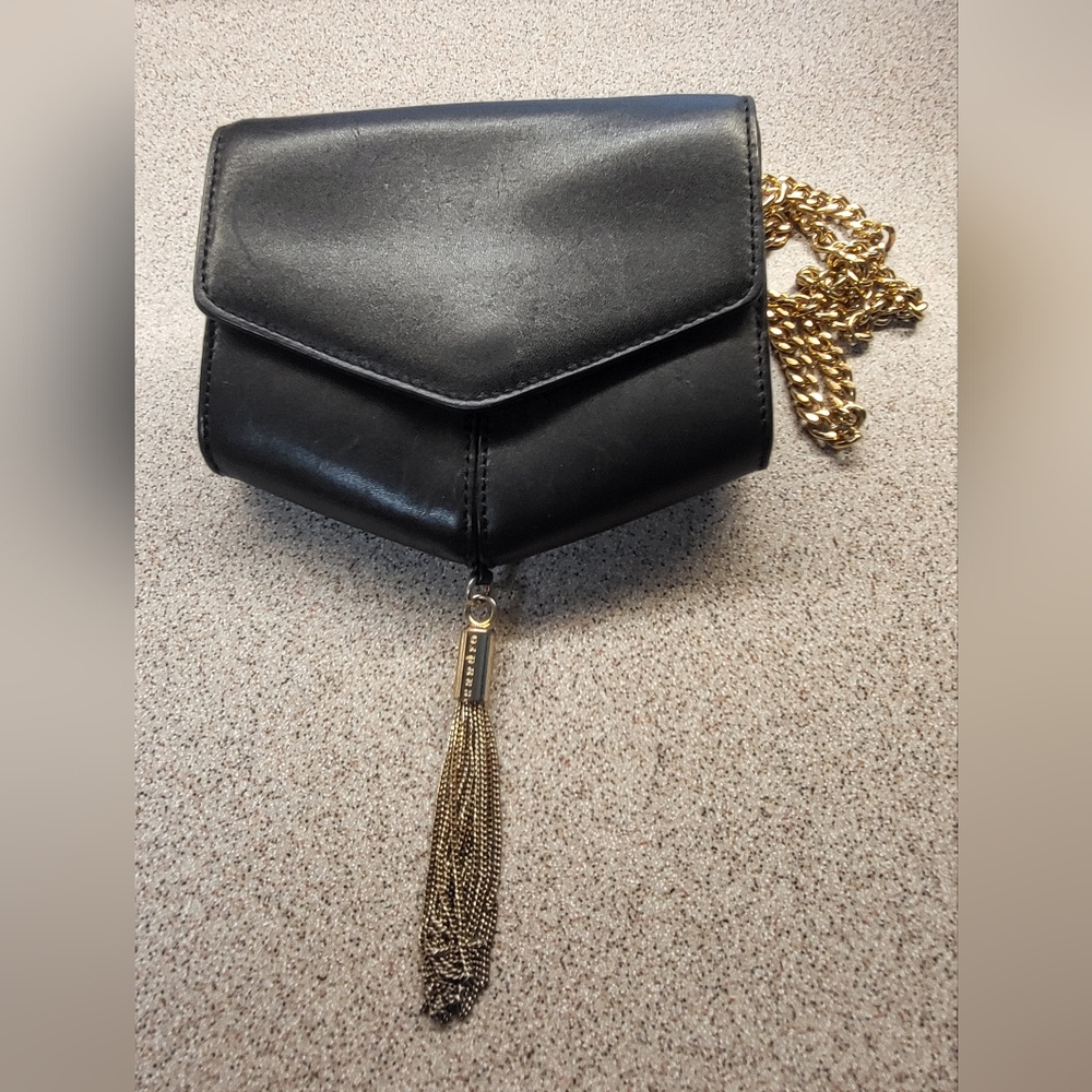 Sandro black leather bag with gold chain and tassel.